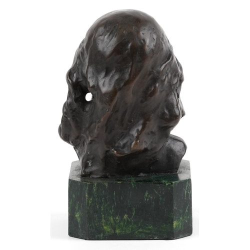 2703 - Patinated bronze head and shoulder bust of a young female raised on a green marbleised base, 15cm hi... 