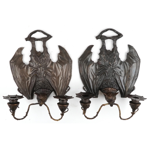 613 - Pair of Art Nouveau style patinated bronze bat design wall sconces, each 34cm high