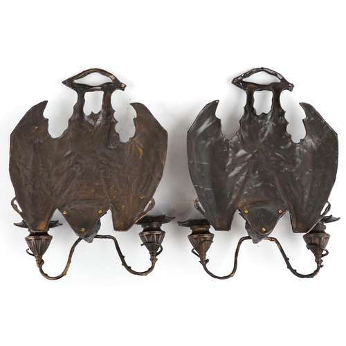 613 - Pair of Art Nouveau style patinated bronze bat design wall sconces, each 34cm high