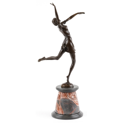 547 - Patinated bronze statuette of an semi nude Art Deco female raised on a circular marble and black sla... 