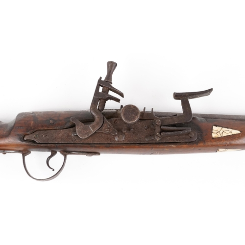 1426 - Middle Eastern flintlock hunting musket with carved bone inlay, 135cm in length