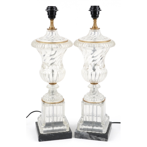 475 - Pair of French style glass urn table lamps with gilt metal mounts raised on faux marble bases, each ... 