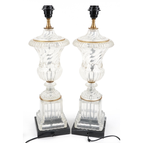 475 - Pair of French style glass urn table lamps with gilt metal mounts raised on faux marble bases, each ... 