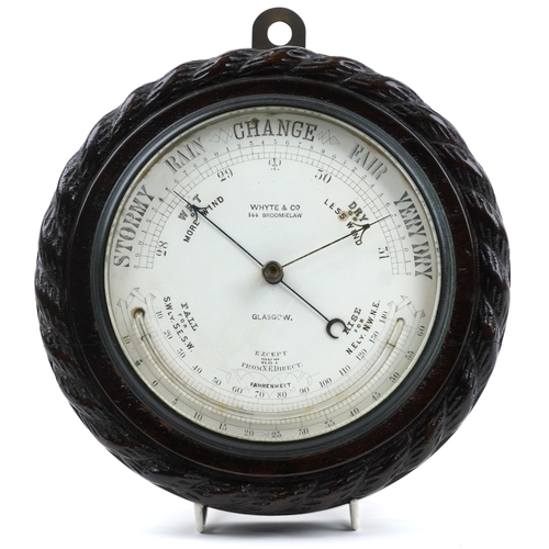 2581 - Carved oak wall barometer with thermometer retailed by Whyte & Co of Glasgow, 22.5cm in diameter