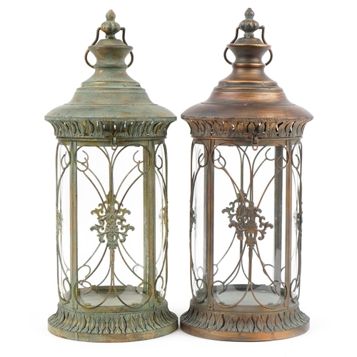 2452 - Two partially gilt lantern design candleholders, 57cm high