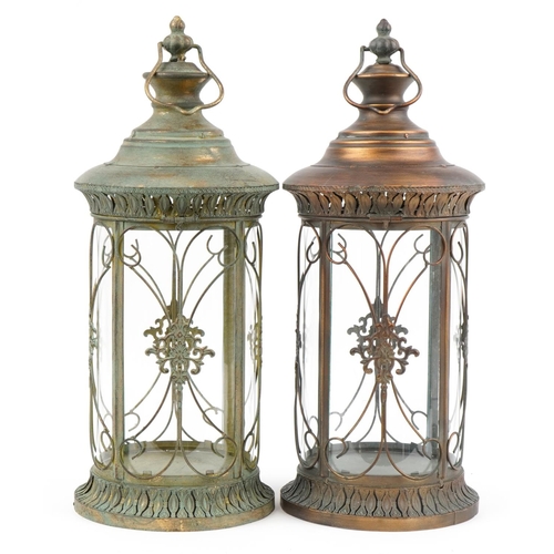 2452 - Two partially gilt lantern design candleholders, 57cm high