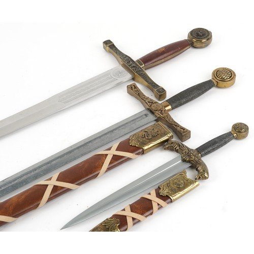 1455 - Two Medieval style King Arthur Excalibur swords, one with scabbard and a dagger with sheath, the lar... 