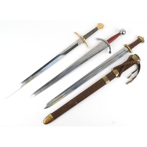 1457 - Three medieval style swords including one with sheath, the largest 24.5cm in length