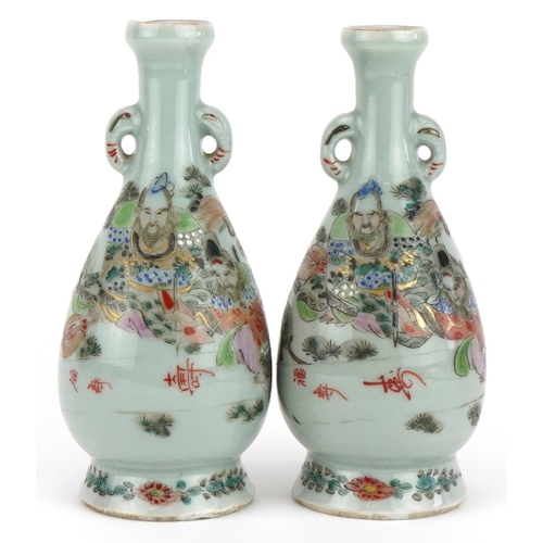 463 - Pair of Japanese porcelain vases hand painted with a father and children, signed with calligraphy an... 