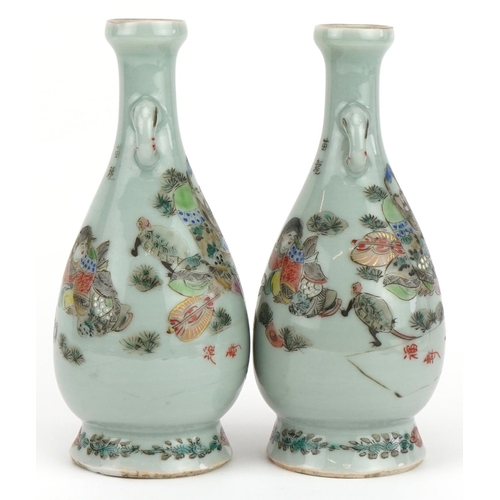 463 - Pair of Japanese porcelain vases hand painted with a father and children, signed with calligraphy an... 