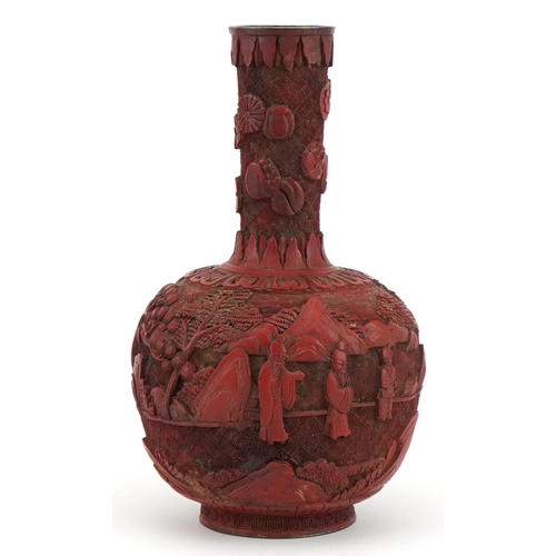 397 - Chinese cinnabar lacquered vase carved with figures in a landscape, 25cm high