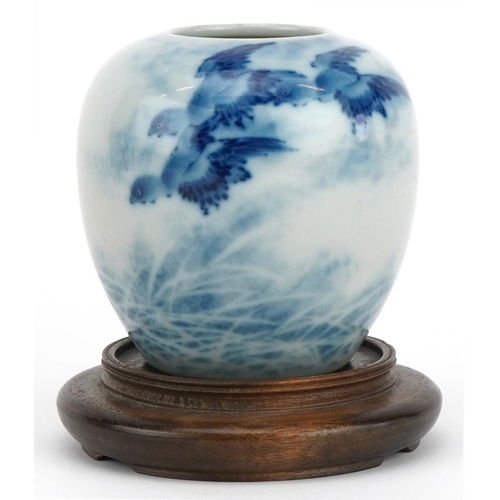 648 - Chinese blue and white porcelain vase with hardwood stand hand painted with birds above waves, overa... 