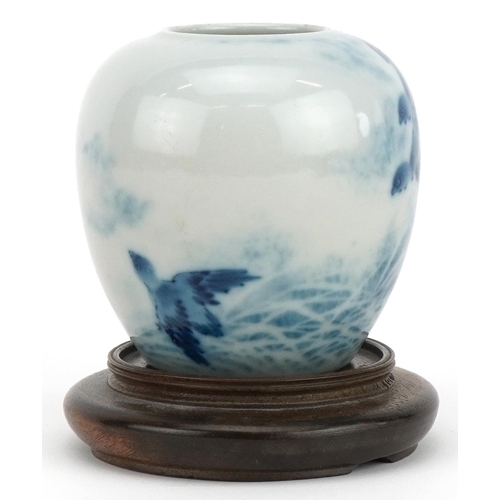 648 - Chinese blue and white porcelain vase with hardwood stand hand painted with birds above waves, overa... 