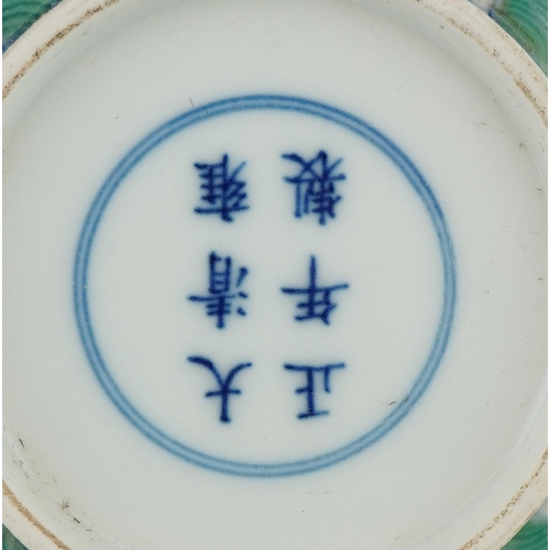 303 - Two Chinse doucai porcelain dishes, each hand painted with a dragon chasing the flaming pearl amongs... 