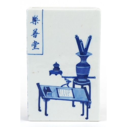 136 - Chinese blue and white porcelain scroll weight in the form of a book hand painted with a scholar's d... 