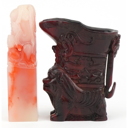 2589 - Chinese reproduction libation cup and a simulated soapstone seal carved with an elder, the largest 1... 