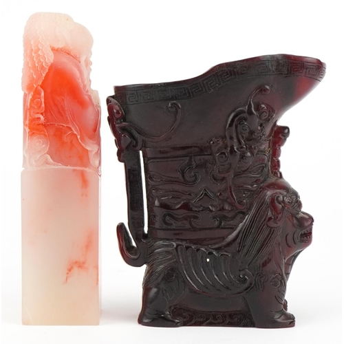 2589 - Chinese reproduction libation cup and a simulated soapstone seal carved with an elder, the largest 1... 