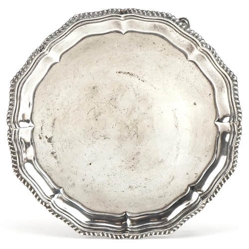 452 - Hawksworth, Eyre & Co Ltd, Victorian circular silver three footed card tray, Sheffield 1896, 15cm in... 