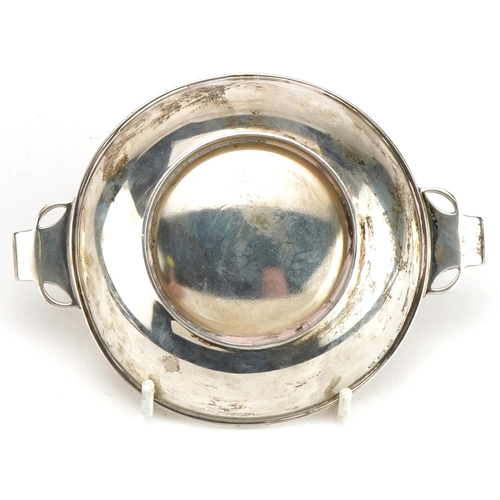 160 - Adie Brothers Ltd, Arts & Crafts style circular silver quaich with twin handles, Birmingham 1936, 13... 