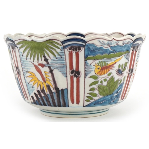 2719 - Makkum, Dutch Maiolica bowl hand painted with birds and flowers, 21cm in diameter