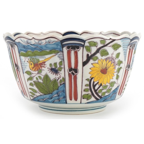 2719 - Makkum, Dutch Maiolica bowl hand painted with birds and flowers, 21cm in diameter