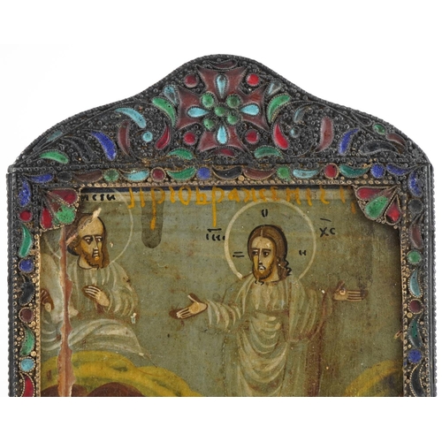 585 - Rectangular Russian icon hand painted with saints housed in an unmarked silver and champleve enamel ... 