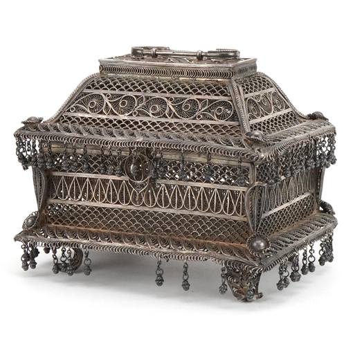 Indian Goa silver filigree table casket with tassel drops, the plaque impressed M L Bros CTC to the base, 11.5cm H x 15cm W x 10cm D excluding the handle, 622g
