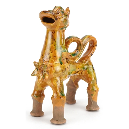 279 - Turkish Canakkale pottery ewer having a yellow and green glaze, in the form of a lion, 20cm high