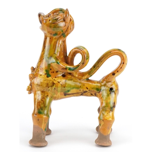 279 - Turkish Canakkale pottery ewer having a yellow and green glaze, in the form of a lion, 20cm high