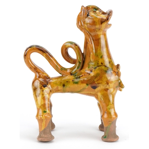 279 - Turkish Canakkale pottery ewer having a yellow and green glaze, in the form of a lion, 20cm high