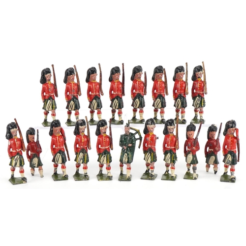 1131 - Nineteen Britains hand painted lead Gordon Highlanders soldiers and piper, some with articulated arm... 