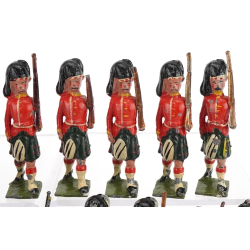 1131 - Nineteen Britains hand painted lead Gordon Highlanders soldiers and piper, some with articulated arm... 