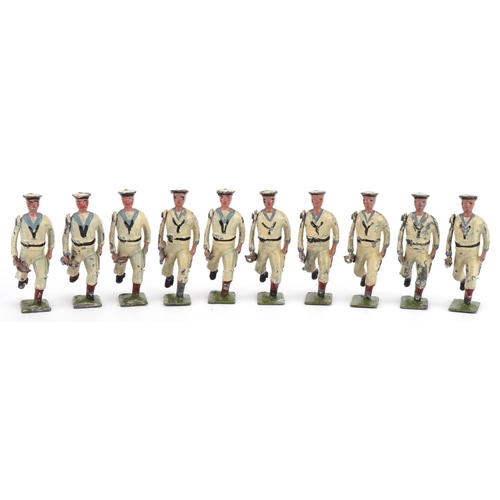 1130 - Ten Britains hand painted lead The US Navy White Jacket soldiers with articulated arms, with paper l... 