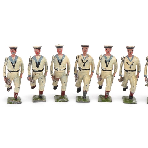 1130 - Ten Britains hand painted lead The US Navy White Jacket soldiers with articulated arms, with paper l... 