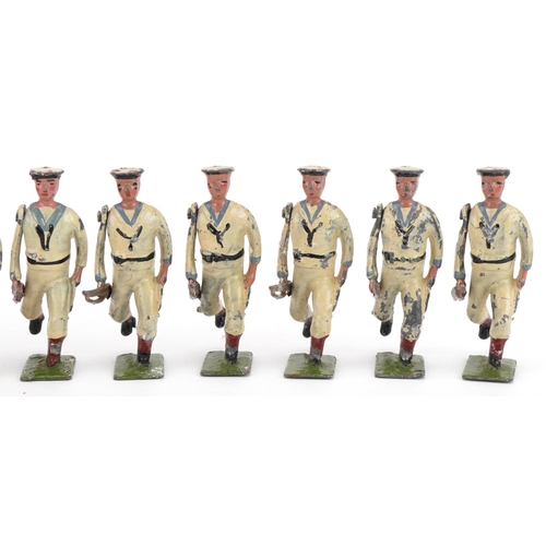 1130 - Ten Britains hand painted lead The US Navy White Jacket soldiers with articulated arms, with paper l... 