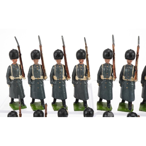 1133 - Eighteen Britains hand painted lead Grenadier Guards in Winter Dress soldiers with articulated arms