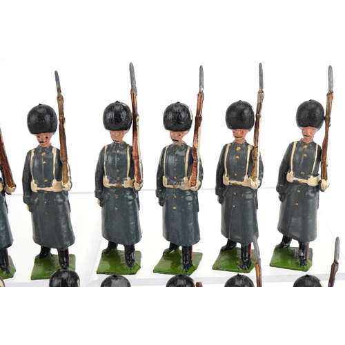 1133 - Eighteen Britains hand painted lead Grenadier Guards in Winter Dress soldiers with articulated arms