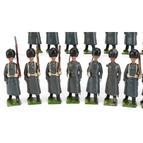 1133 - Eighteen Britains hand painted lead Grenadier Guards in Winter Dress soldiers with articulated arms