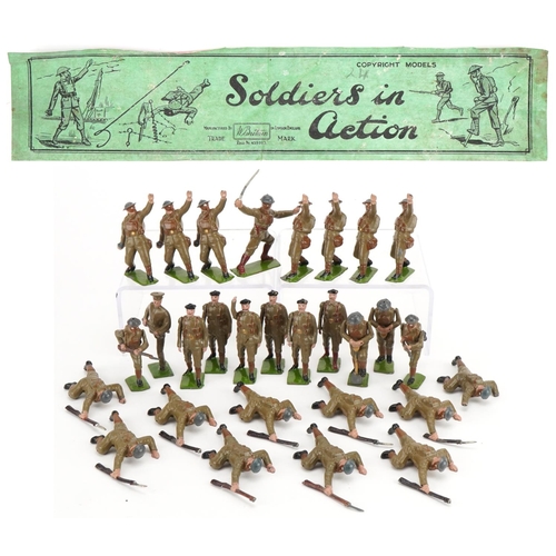 1121 - Collection of Britains hand painted lead soldiers in action, some with articulated arms, with paper ... 