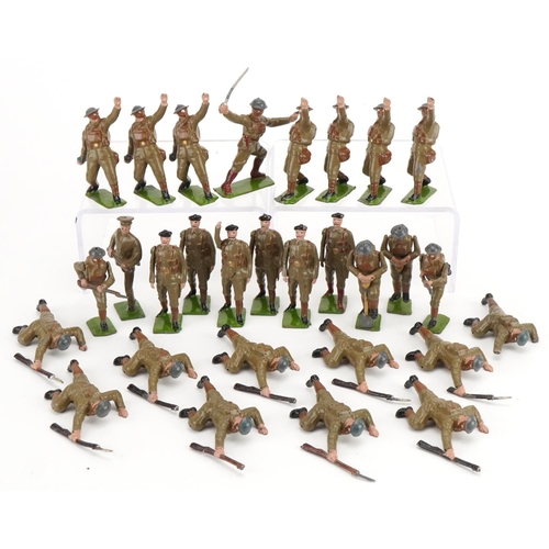 1121 - Collection of Britains hand painted lead soldiers in action, some with articulated arms, with paper ... 