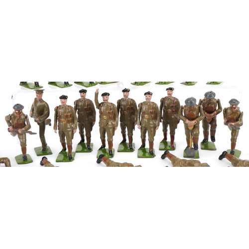 1121 - Collection of Britains hand painted lead soldiers in action, some with articulated arms, with paper ... 