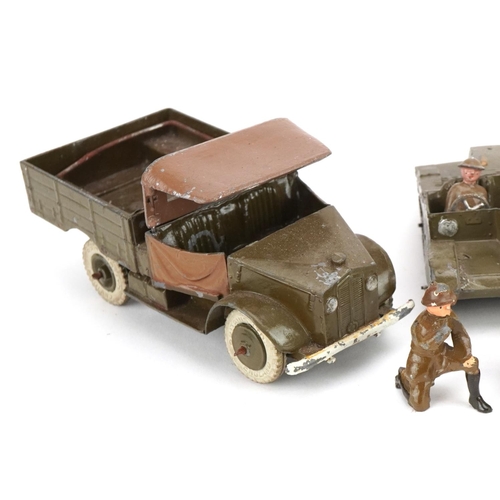 1135 - Two Britains hand painted lead military interest Beetle lorries and a Bren Gun carrier, with paper l... 