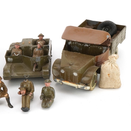 1135 - Two Britains hand painted lead military interest Beetle lorries and a Bren Gun carrier, with paper l... 