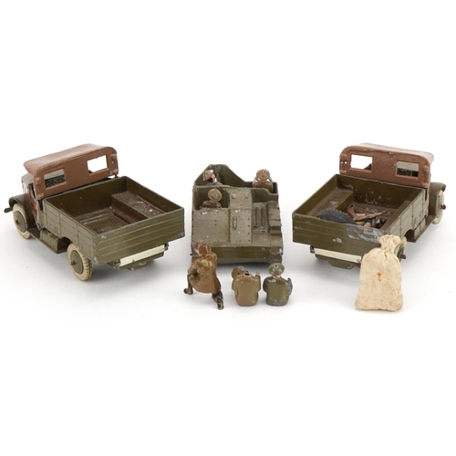 1135 - Two Britains hand painted lead military interest Beetle lorries and a Bren Gun carrier, with paper l... 