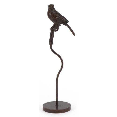 2514 - Patinated bronze sculpture of a bird perched on a branch, 17cm high