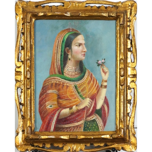 2132 - Top half portrait of an Indian female in traditional dress, oil, housed in a gesso frame, glazed, 23... 