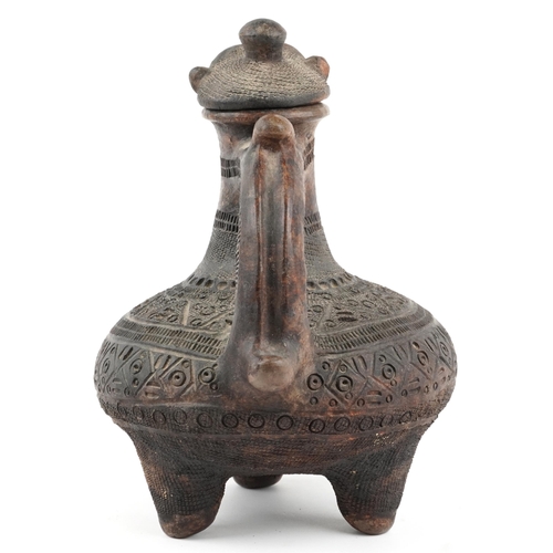 415 - African tribal interest Maragoli clay three footed vessel with animalia lid profusely incised with g... 