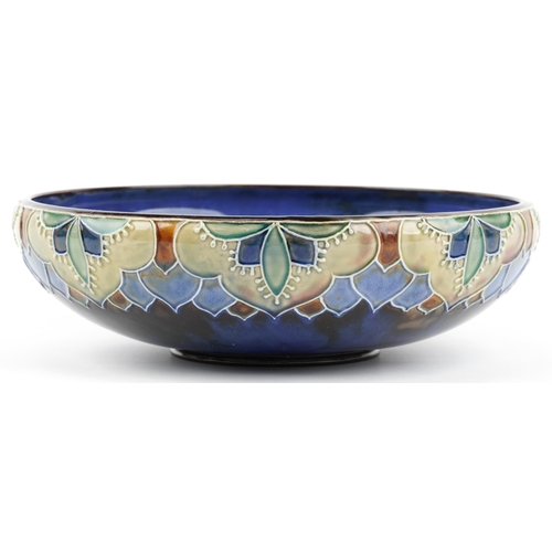 433 - Royal Doulton, Art Nouveau stoneware bowl decorated in low relief with stylised flowers, impressed X... 