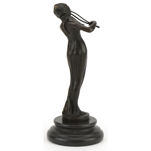 485 - Patinated bronze statuette of an Art Nouveau female playing a violin raised on a circular marbleised... 