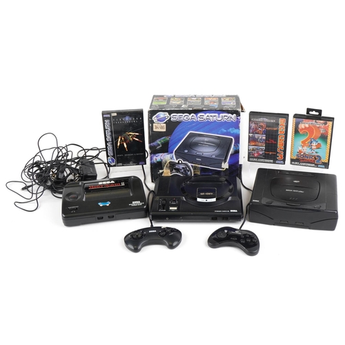 1206 - Vintage Sega games consoles and games including Sega Saturn with box, Sega Master System II and Sega... 